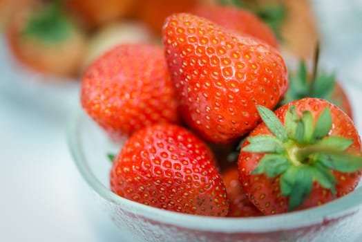 Strawberry is red fresh berry fruit color and sweet juicy for sale at Thai street food and fruit market in concept food and fruit, healthy eating in life