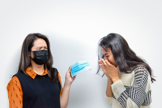 Asian pretty women wearing mask respiratory protection mask against epidemic flu covid19 or corona virus from wuhan in office with fear emotion in concept illness, outbreak, healthcare in life