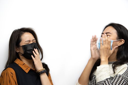 Asian pretty women wearing mask respiratory protection mask against epidemic flu covid19 or corona virus influenza in office with fear emotion in concept illness, outbreak, healthcare in life