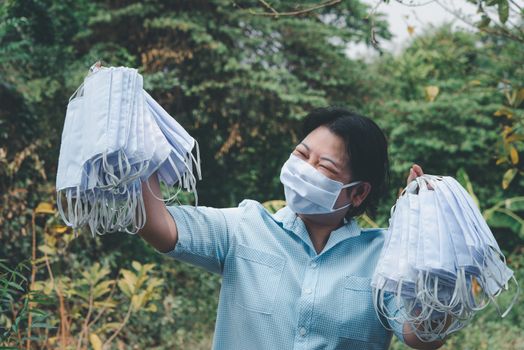 Asian pretty woman wearing mask respiratory protection mask against epidemic flu covid19 or corona virus from wuhan in office with fear emotion in concept illness, outbreak, healthcare in life