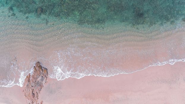 Aerial view of beach with sea wave 