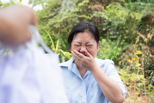 Asian pretty woman wearing mask respiratory protection mask against epidemic flu covid19 or corona virus from wuhan in office with fear emotion in concept illness, outbreak, healthcare in life