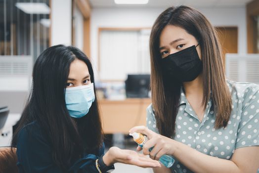 Asian women wearing mask and alcohol antibacterial hand gel respiratory protection mask against epidemic flu covid19 or corona virus with fear emotion in concept illness, outbreak, healthcare in life