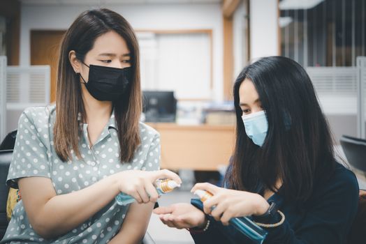 Asian women wearing mask and alcohol antibacterial hand gel respiratory protection mask against epidemic flu covid19 or corona virus with fear emotion in concept illness, outbreak, healthcare in life