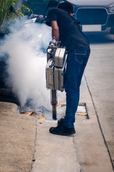 People fogging DDT spray for mosquito kill and protect by control mosquito is a carrier of Malaria, Encephalitis, Dengue and Zika virus in village.