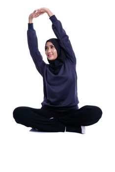 Fitness Muslim Asian girl doing stretch exercise, on white background.