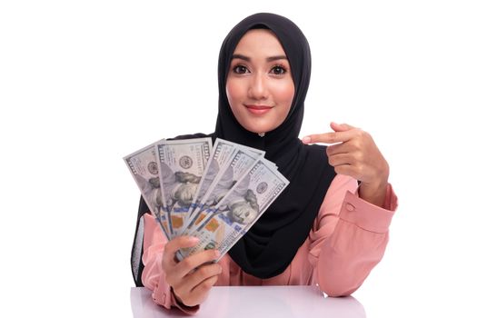 Expression face of pretty muslim woman with money. Finance conceptual or business growth.