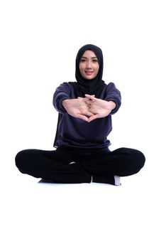 Fitness Muslim Asian girl doing stretch exercise, on white background.