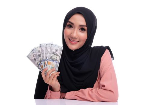 Expression face of pretty muslim woman with money. Finance conceptual or business growth.