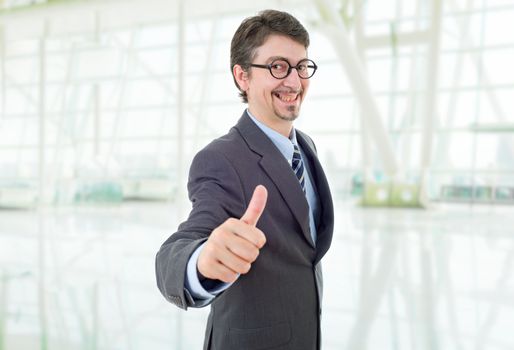 young business man going thumb up, at the office