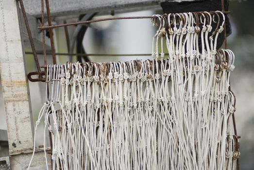 Fishing Hooks On A Blurred Background