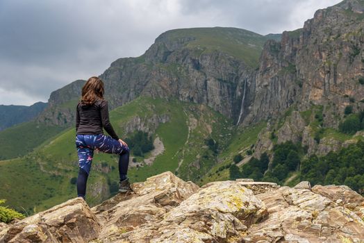 Lone active woman at the edge of the cliff, Central balkan, Bulgaria.