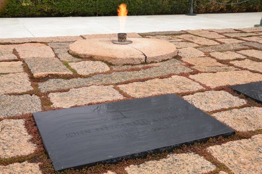 The eternal flame continuously burns at the grave of John F Kennedy in Arlington National Cemetery