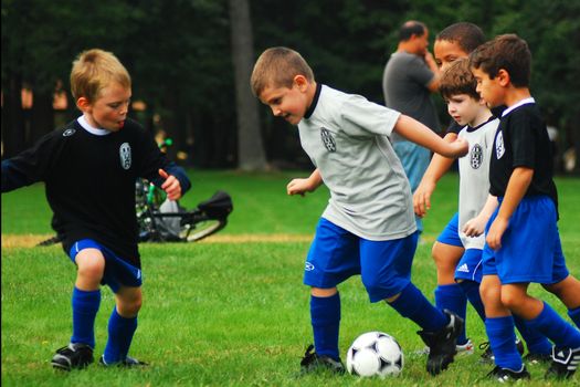 Young boys engage in fierce competition at a youth soccer game
