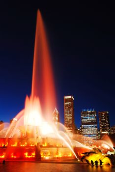 Flood let waters shoot up from the Buckingham Fountain at night in Chicago