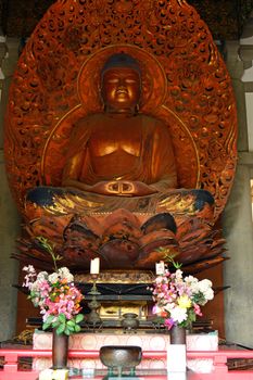 A statue of Buddha sits in the Byodo-in temple at the Valley of the Temples in Hawaii