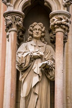 Stone carved statue of the scholar and theologian Richard Bentley (1662 - 1742). Outer wall of the Chapel of St John's College, Cambridge. Bentley was the founder of historical philology.