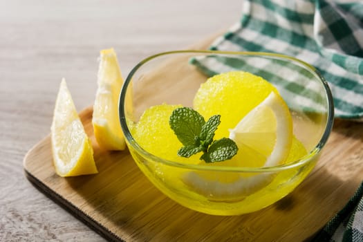 Lemon sorbet in glasses on white wooden background