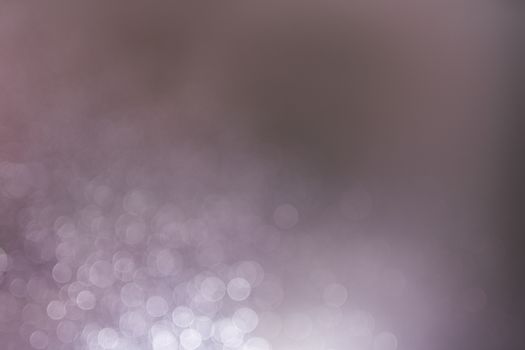 Abstract bokeh from light and water spray in backgrounds of various colors