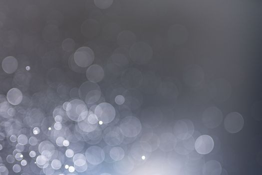 Abstract bokeh from light and water spray in backgrounds of various colors