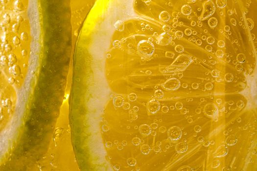 Lemon background. Close up view of lemon slices. Citrus texture