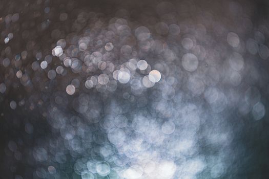 Abstract bokeh from light and water spray in backgrounds of various colors