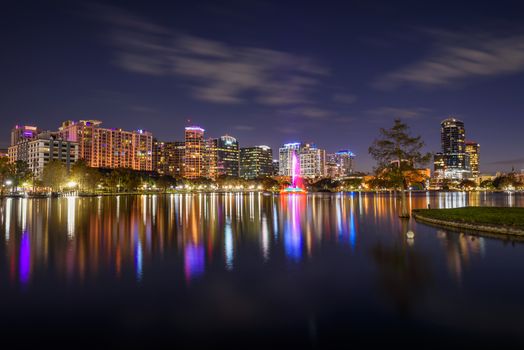Night skyline of Orlando, Florida, with Lake Eola in the foreground. Long exposure.