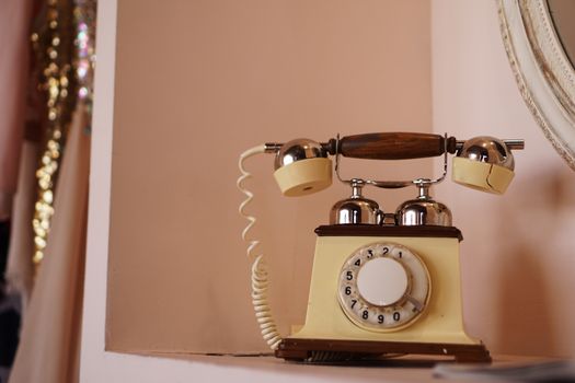 Old retro style phone on the shelf