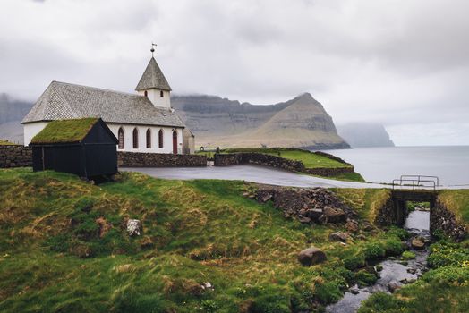 Small church in the village of Vidareidi situated on the sea shore. Vidareidi is the northernmost settlement in the Faroe Islands and lies on the Island of Vidoy.