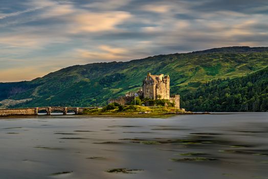 Sunset over Eilean Donan Castle, Scotland, United Kingdom. Long exposure.