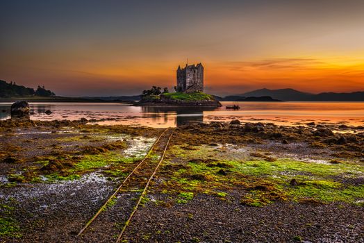 Sunset over Castle Stalker, Highlands, Scotland, United Kingdom. Long exposure and hdr processed.