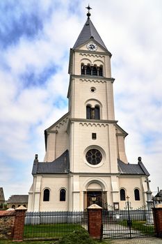 A historic parochial church with a belfry  Poland