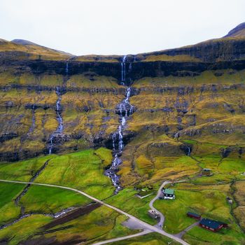Aerial view of waterfalls in the village of Saksun on the Faroe islands, Denmark.