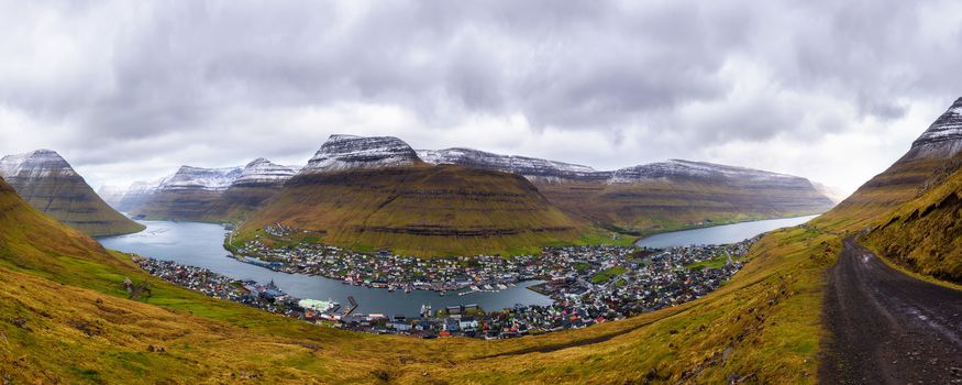 Panorama of the city of Klaksvik with a dirt road on Bordoy island, Faroe Islands, Denmark