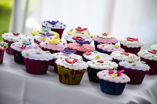 Cupcakes on the sweet table of a wedding