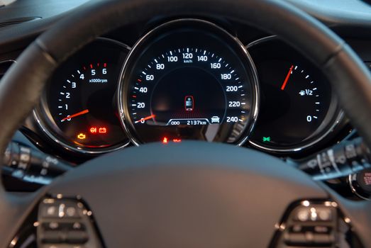 Closeup shot of a speedometer and tachometer of a modern car