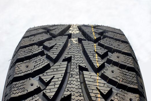 Brand new modern winter car tire, fragment