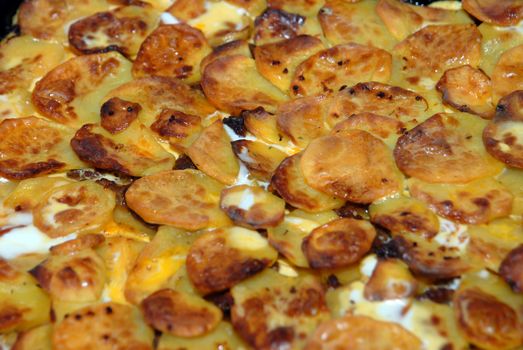 Traditional moussaka - A dish from meat, potatoes, vegetables with the baked cheese