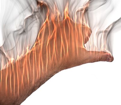 A human hand on fire burning with orange flames and some smoke in front of a white background