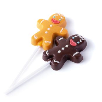 Chocolate Christmas gingerbread man decorated with white lines isolated over white background