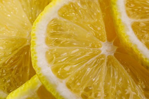 Lemon background. Close up view of lemon slices. Citrus texture