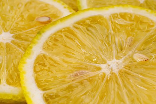 Lemon background. Close up view of lemon slices. Citrus texture