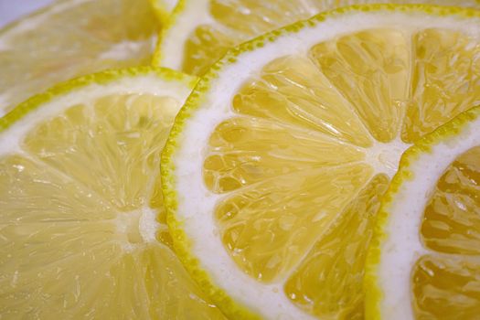 Lemon background. Close up view of lemon slices. Citrus texture