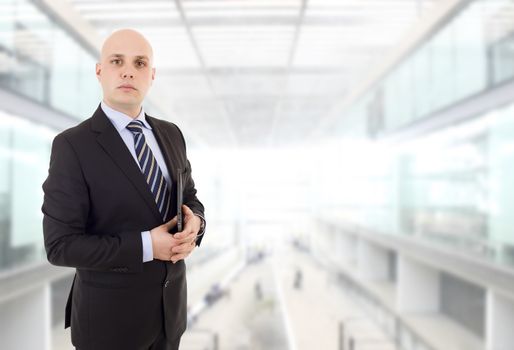 proud businessman with a tablet pc, at the office