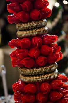 Red chocolate candies in the shape of a rose