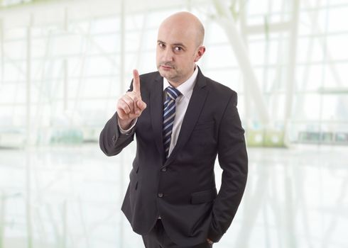 mad business man pointing, at the office