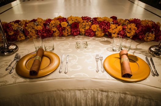 Decorating the table of the bride and groom at the wedding party