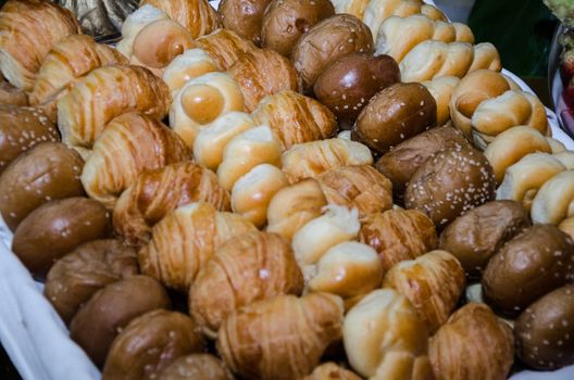 Variety of small breads on the snack table