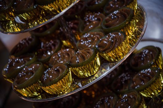 Mini chocolate cupcakes with silver candy balls