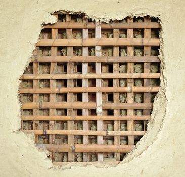 Traditional Chinese farm house wall made from bamboo slats and mud
